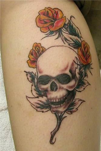 skull tattoo on back. skull and roses tattoo.