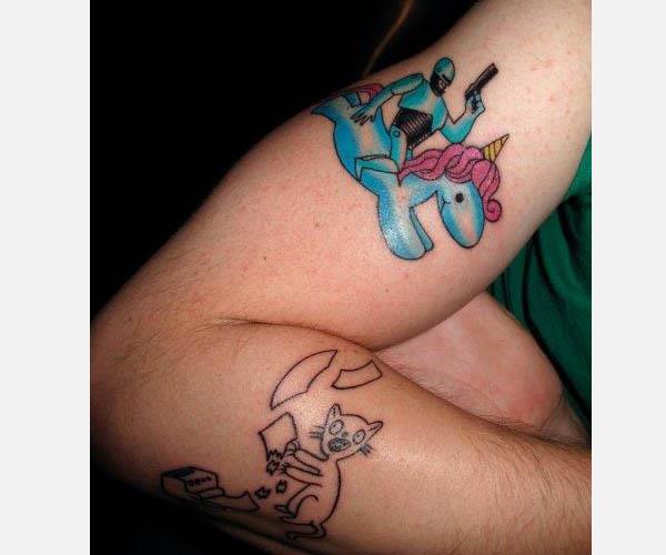 Robocop riding a unicorn tattoo Unbelievably Weird Unicorn Tattoos