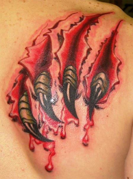claws tearing through shoulder tattoo Claws Ripping Through Flesh Tattoo
