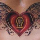 Locked Heart With Wings Lower Back Tattoo